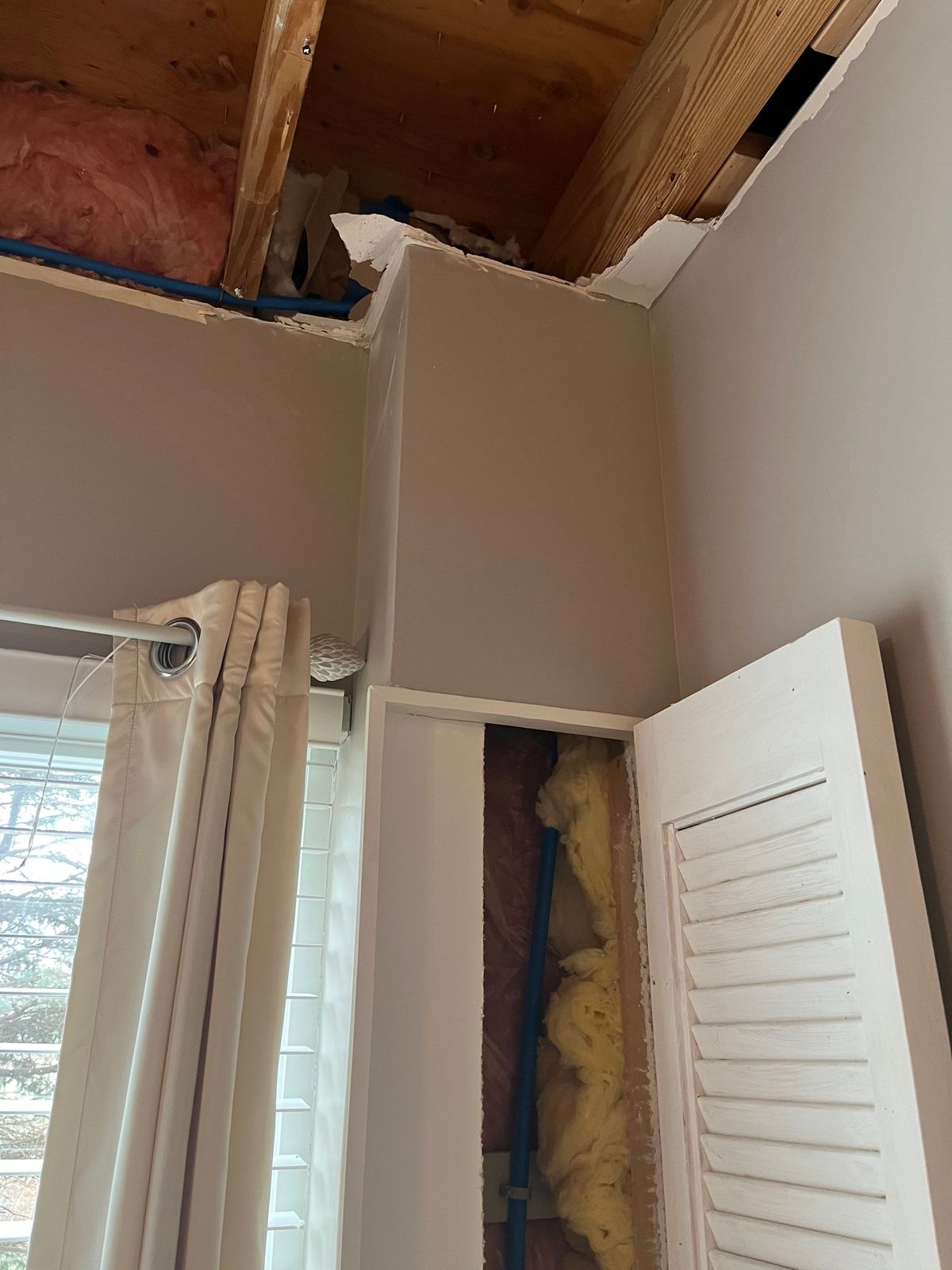 Collapsed ceiling drywall in the upstairs bedroom