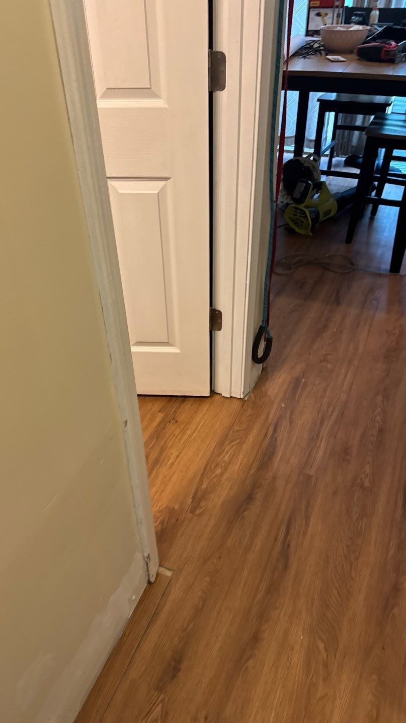 Water-damaged wood flooring in the kitchen