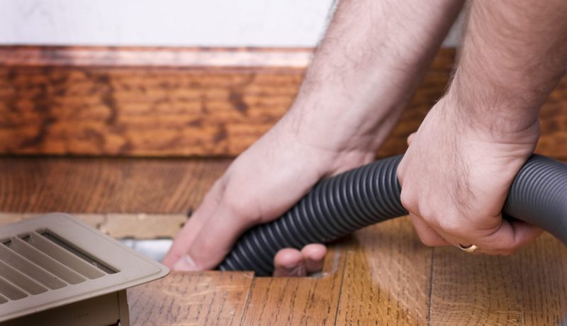 STOCK IMAGE: Service man cleaning out the air duct in a home. (iStock)